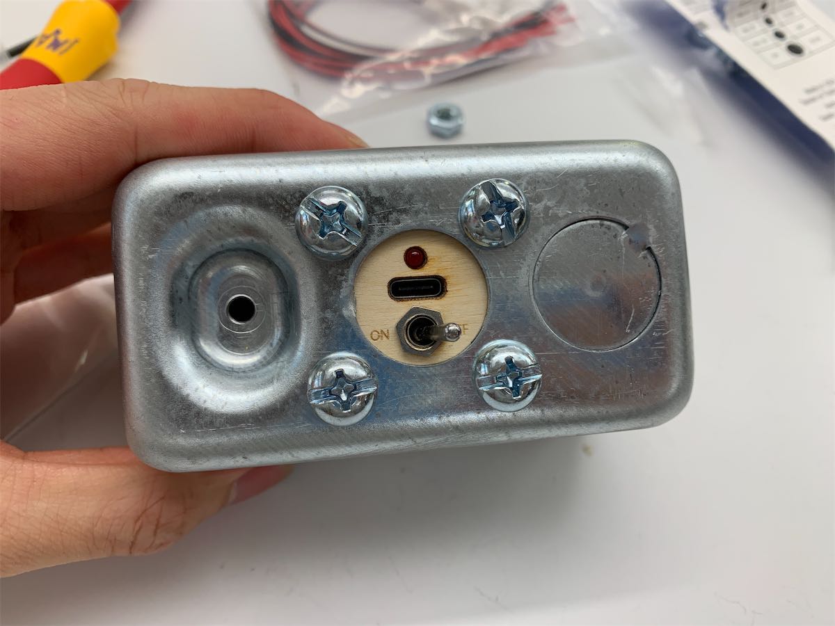 back of the speaker with every port and switch