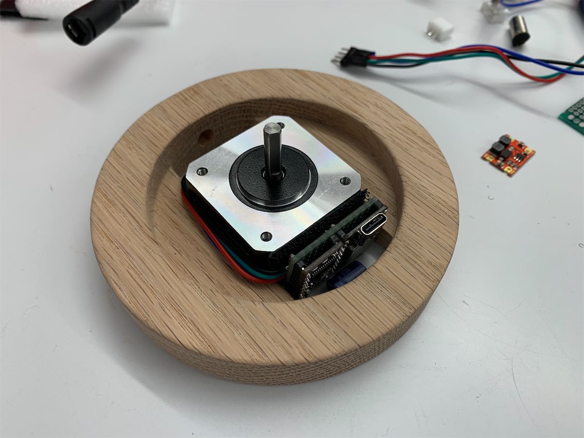 a stepper motor and a protoboard fit in the base